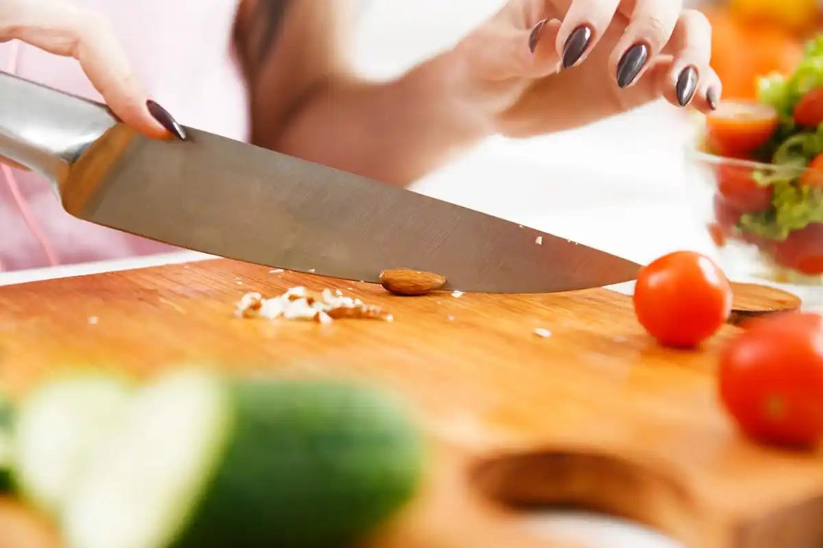 kitchen knife cutting food close up