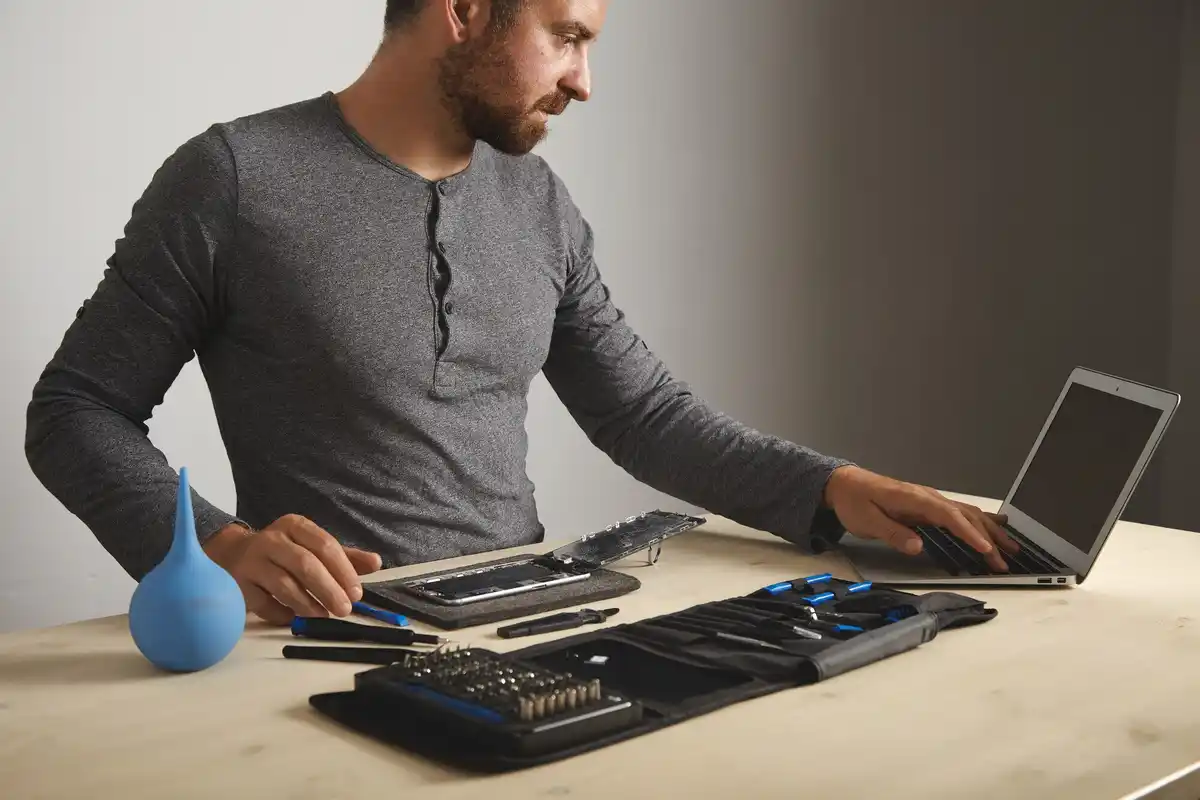 frustrated person using technology laptop phone repair