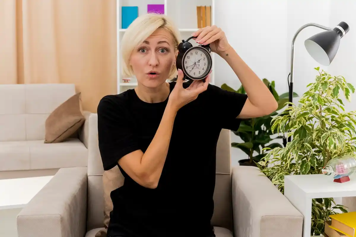person procrastinating at desk with timer